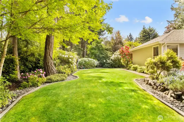 paved edging, pathways and river rocks surround the yard for easy maintenance