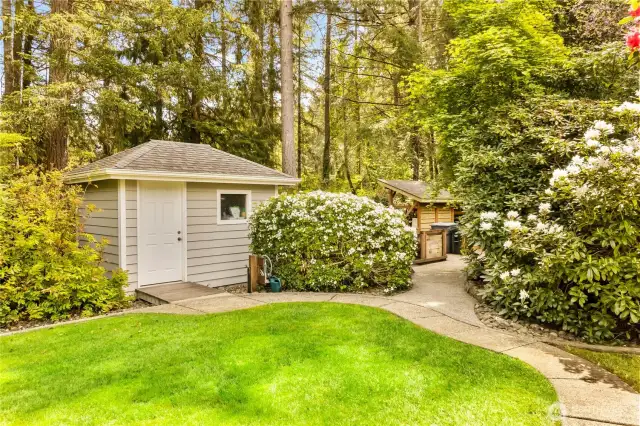 Two enclosed sheds. Sprinkler system and multiple hose spickets around the property for easy garden care.