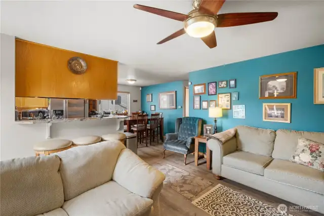 Living room open to dining room and kitchen.