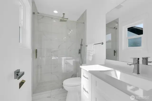 Primary Bedroom en-suite bathroom with rain shower head and beautiful tile - 8042 19th Ave NW, Seattle, WA 98117