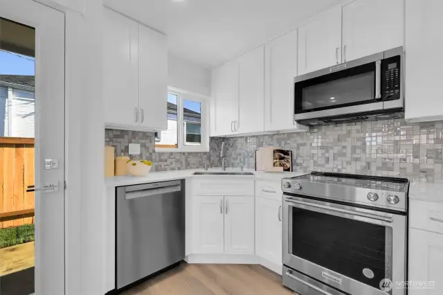 Private access to fully fenced yard from the kitchen  - 8042 19th Ave NW, Seattle, WA 98117