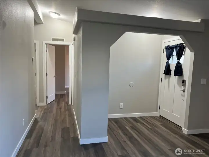 Entry and hallway to bedrooms looking from living room