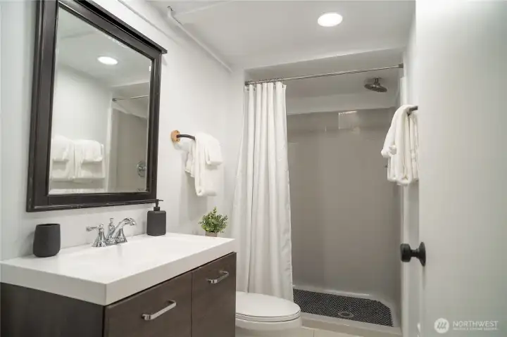 lower level bathroom with tile base & fiberglass shower