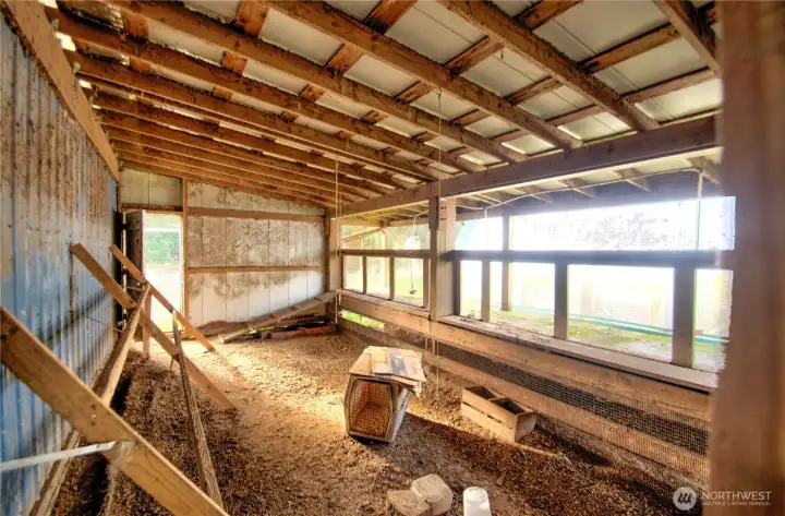 chicken coop off side of shop. Door leads to outdoor run.
