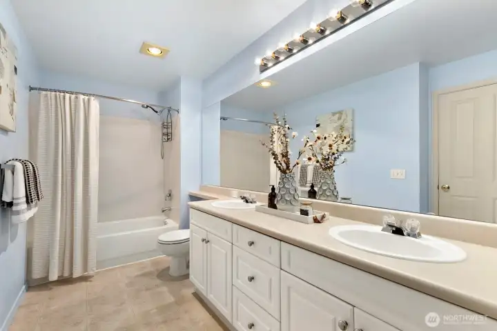 HUGE primary bath with double vanities and great storage.