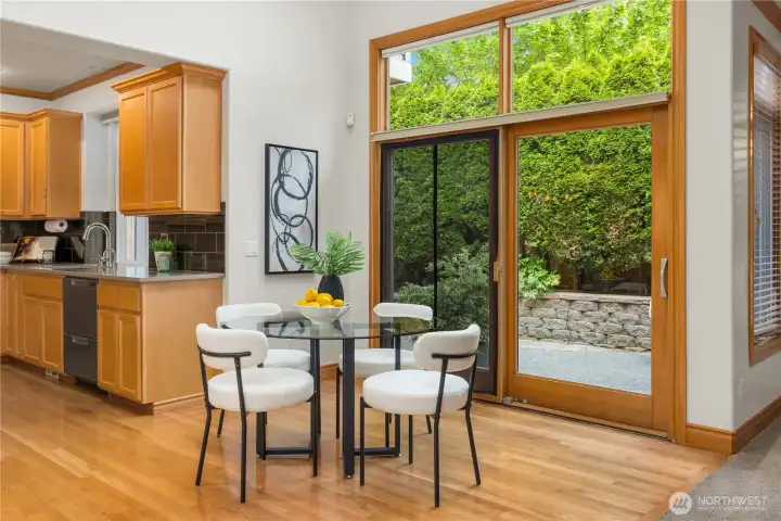 Informal dining area and expansive sliding doors provide easy access to the backyard.