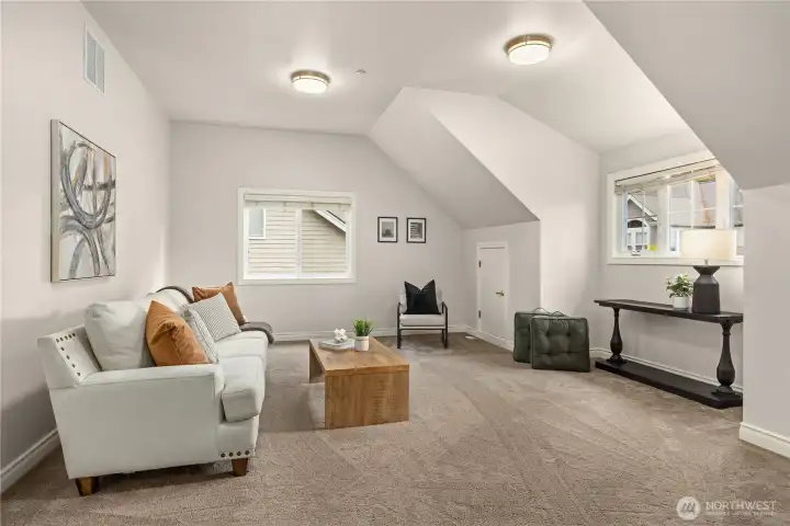 Large bonus room upstairs provides the perfect space for play, media, or relaxation.