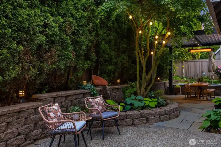 The fully fenced backyard is a private, beautifully cultivated retreat.