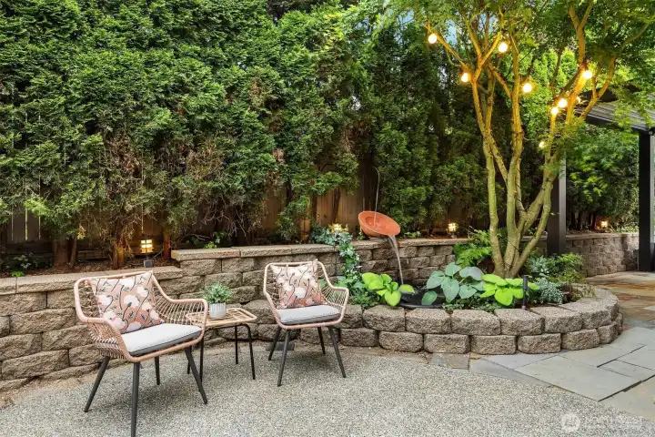 Enjoy relaxing evenings in this beautifully lit backyard oasis.
