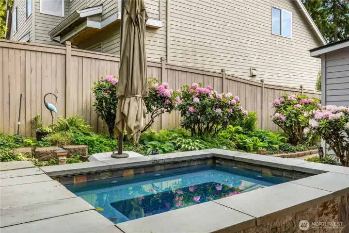 In-ground hot tub provides a spa-like escape at home.