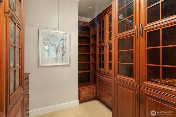 Primary bedroom walk-in closet Primary bedroom walk-in closet