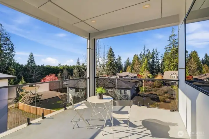 Covered outdoor deck off primary suite.