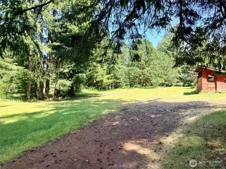 Further down the driveway.