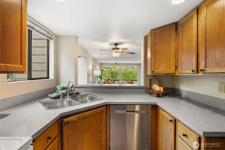 Enjoy views from your kitchen, looking into the dining and living room Enjoy views from your kitchen, looking into the dining and living room
