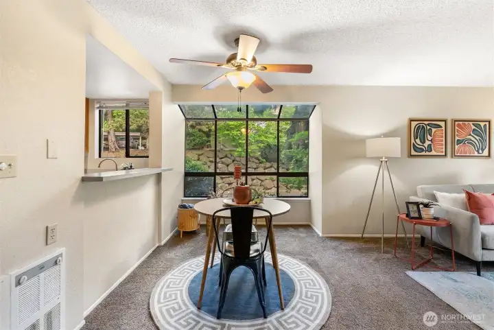 Dining area features a solarium window. Dining area features a solarium window.