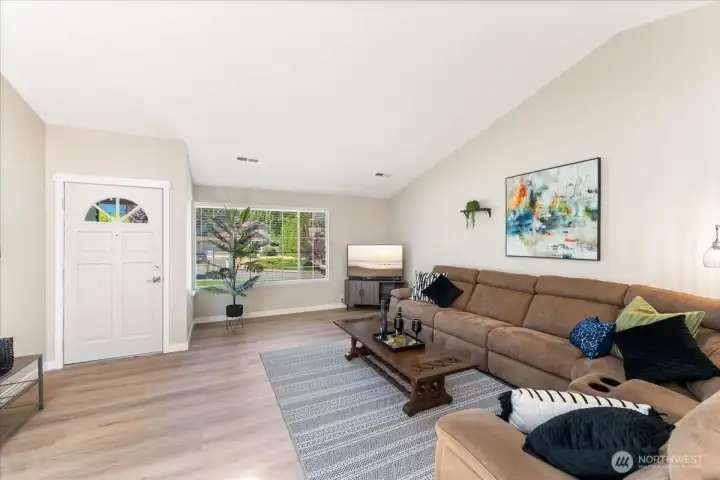 Step inside to soaring vaulted ceilings and an inviting, light-filled great room. Step inside to soaring vaulted ceilings and an inviting, light-filled great room.