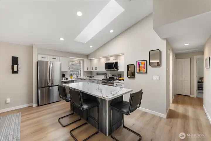 Oversized center island with seating for four is perfect for casual meals and gathering with friends. Oversized center island with seating for four is perfect for casual meals and gathering with friends.