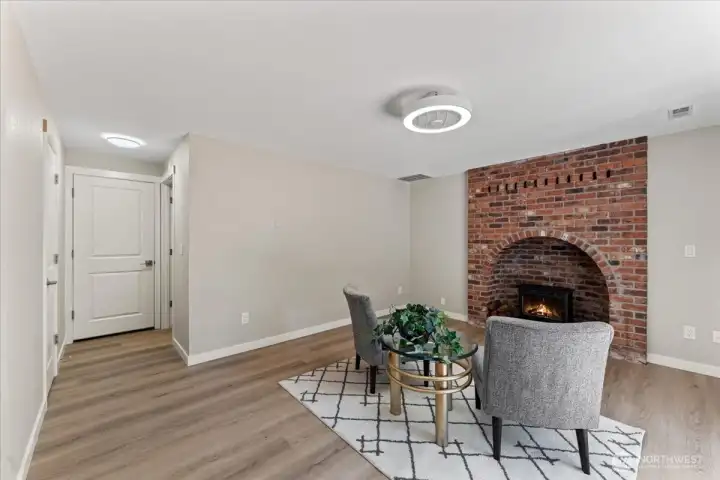 Charming floor-to-ceiling brick fireplace adds warmth and character. Charming floor-to-ceiling brick fireplace adds warmth and character.