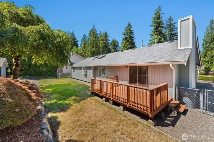 View of the deck, back yard and extra parking on the side of the house. View of the deck, back yard and extra parking on the side of the house.
