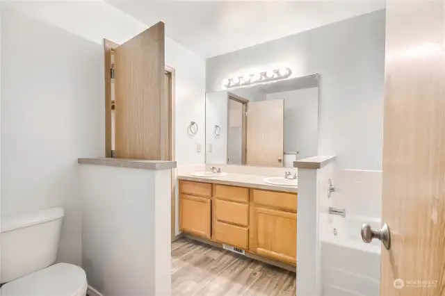 Full primary bathroom with dual sinks.