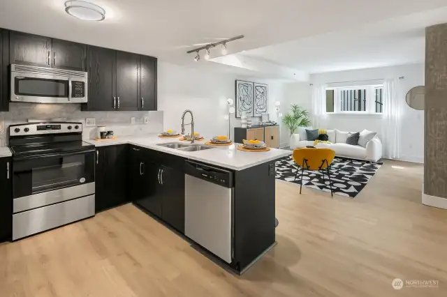 Command central kitchen where the cook is never left out of the action.  New Amana stainless steel stove with easy touch controls and new Frigidaire stainless front control smart dishwasher.