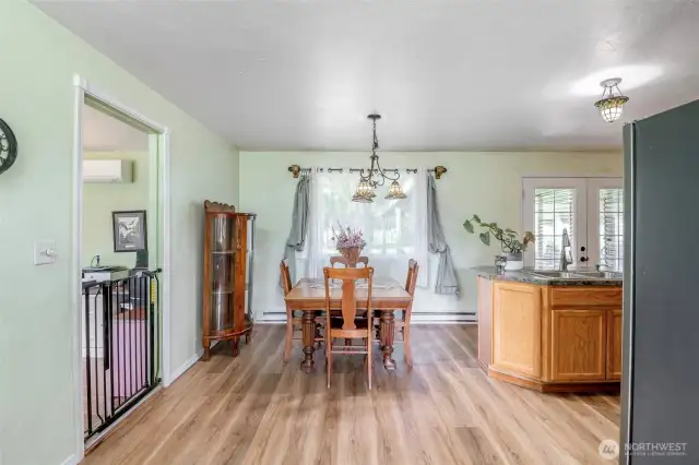 Angle From Living Room To Kitchen. Off To The Left Is The Converted Garage Made Family Room. Off To The Right Are The French Doors To The Patio, Greenhouse And Spacious Back, Partially Fenced Back Yard