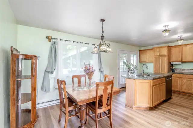 Dining Room And Kitchen To French Patio Doors To The Western Entrance