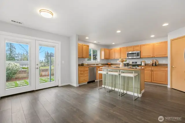 Beautiful french doors lead to patio and fully fenced back yard.
