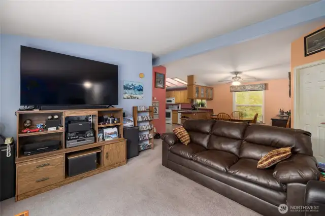 Living area open to the dining room and kitchen.