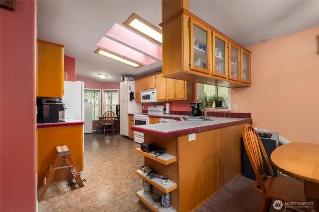 Dining room and kitchen are separated by a bar