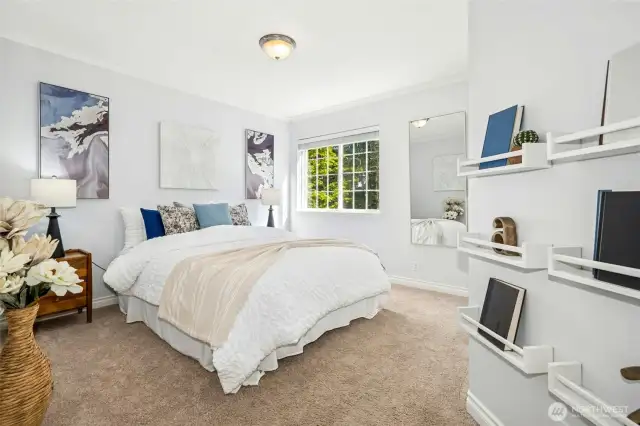Spacious bedroom with serene ambiance.