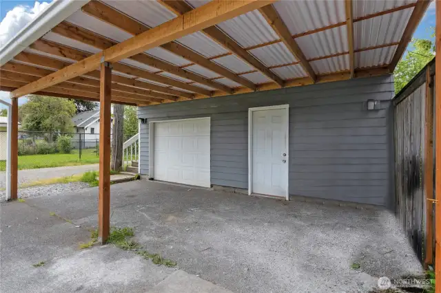 Garage below dwelling unit. Door on right leads to storage area.