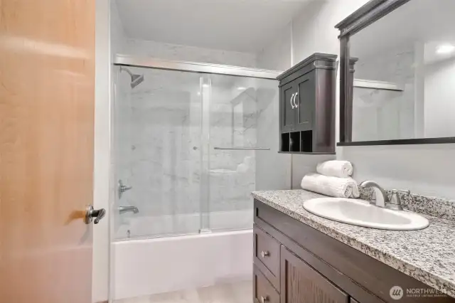 Full bath w/ new tub, new tile wall, new floor and new toilet