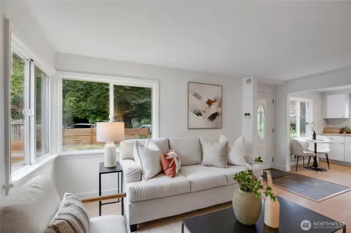 Spacious living area with abundant natural light and serene outdoor views.