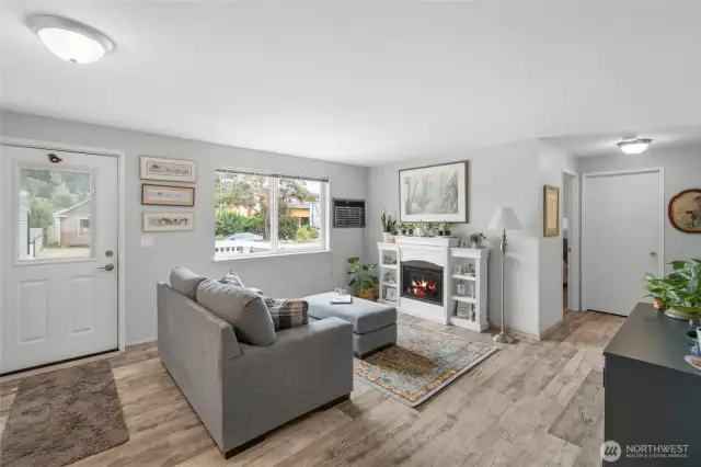 Through the front door you're welcomed into the airy living space with laminate flooring and freshly painted white doors and trim. The fireplace is not built in and does not come with the home.