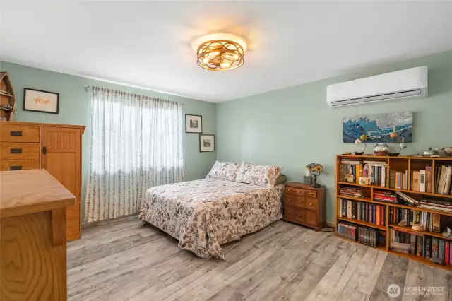 The spacious primary bedroom is located at the back of the home and features a mini-split ductless unit for heating/cooling.
