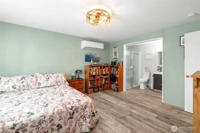 The primary bathroom attached to the bedroom features a shower, sink and toilet and was modified to accommodate ADA needs.