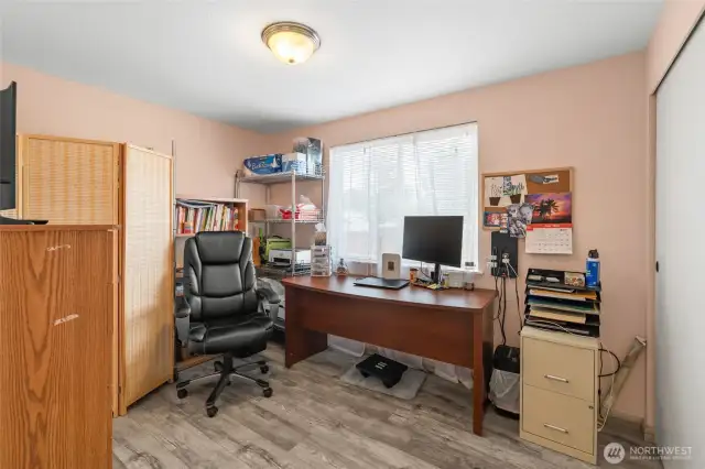 This bedroom is located at the opposite end of the home from the primary and is at the back of the home.