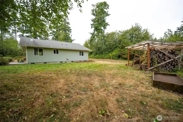 Private backyard with wood storage