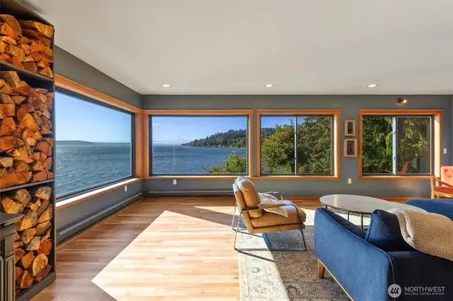 Main floor living room with panoramic views of Mount Rainier, Cascade Mountains and Puget Sound.
