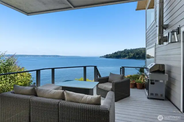 The entertaining size deck on the main floor with steps to the play area and down to beach. The views of Mount Rainier will blow your mind!