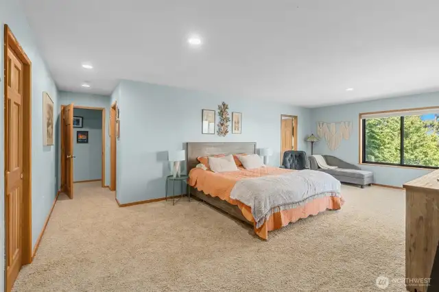 Owner Suite designed like a full hotel room with dual walk-in closets, ensuite luxury bathroom, sitting area, and your own private view deck.