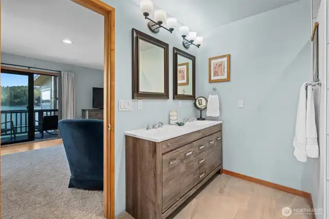Luxury Owner Suite bathroom with dual vanities, oversized walk-in shower with dual showerheads. You even have views from the toilet in this bathroom.