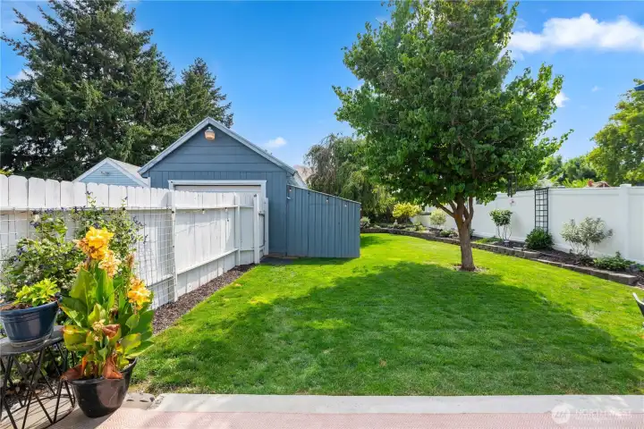 Fenced yard with beautiful landscaping