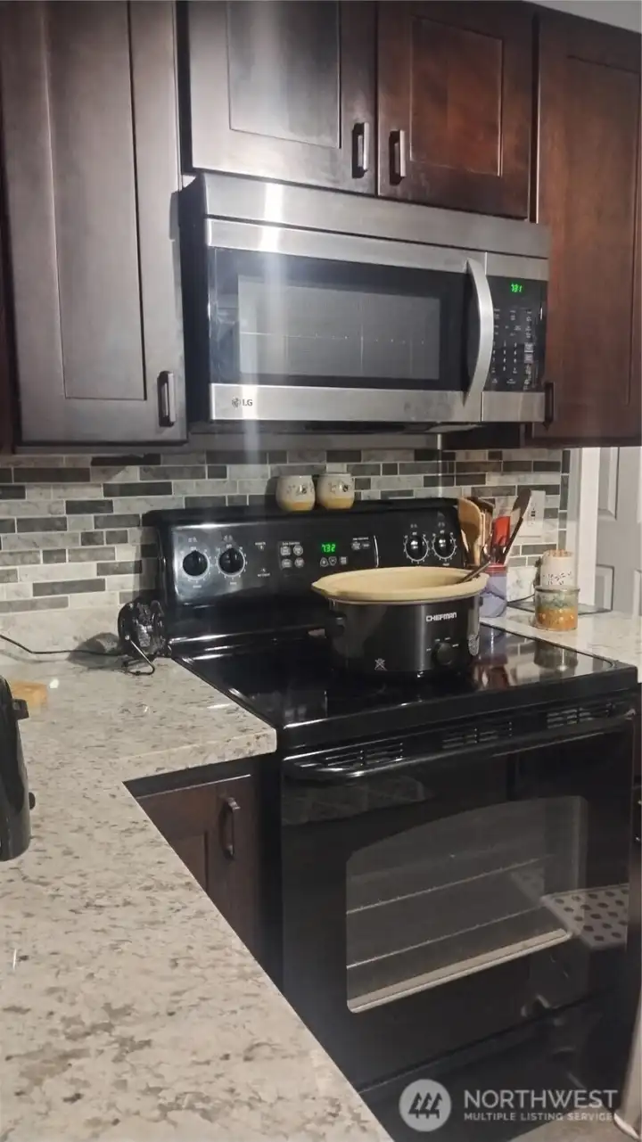 More pictures coming as Owner is painting.  Here you can see the kitchen up close with new counters, cabinets, backsplash, appliances and lighting!