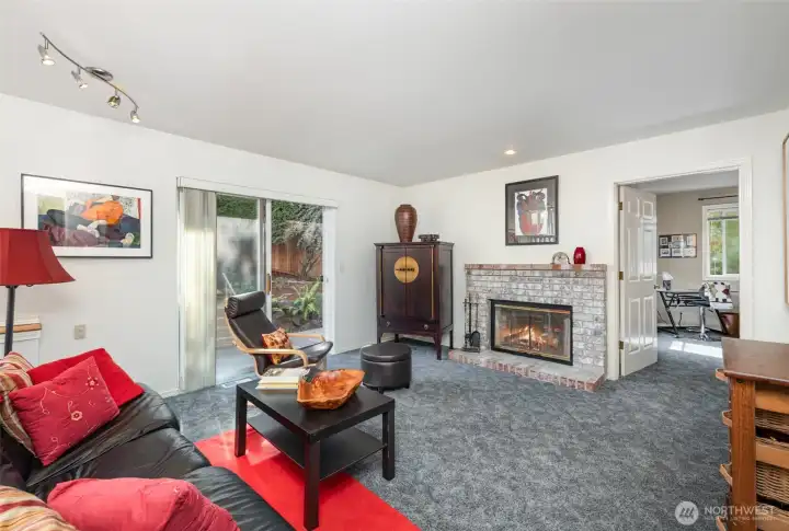 Downstairs you'll find the family room with cozy fireplace and direct access to the backyard.