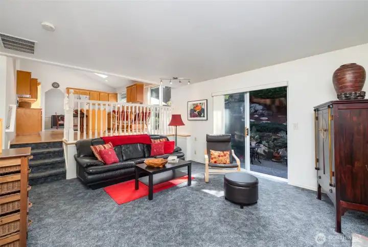 Family room remains subtly separate from the kitchen area, offering a cozy connected space.