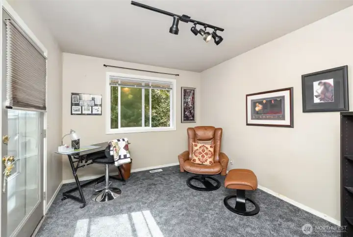 Downstairs den is the perfect flex space for an office, exercise room, or creative studio to suit your needs.