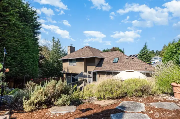 Thoughtfully placed pavers throughout the backyard create peaceful nooks throughout the yard.
