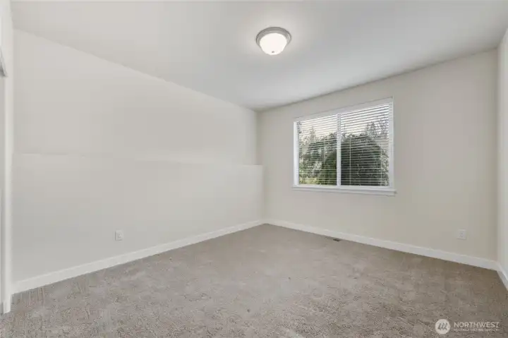 One of two main floor bedrooms located at the front of the house.